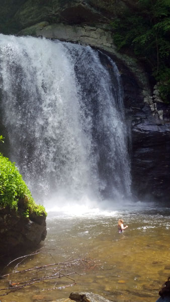 Karen Duquette in the water at Looking Glass Falls